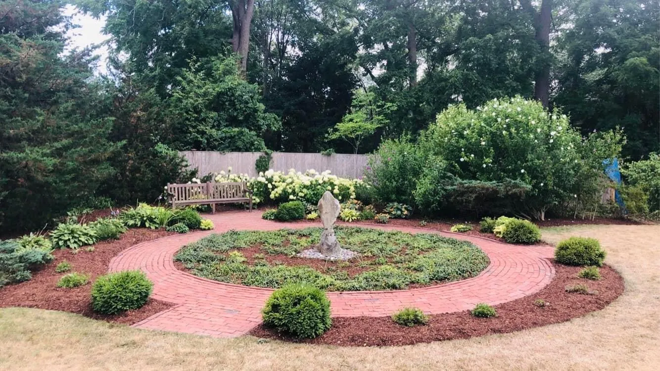 Crew performing seasonal cleanup removing leaves and debris